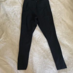 Black yoga pants with mesh pockets.